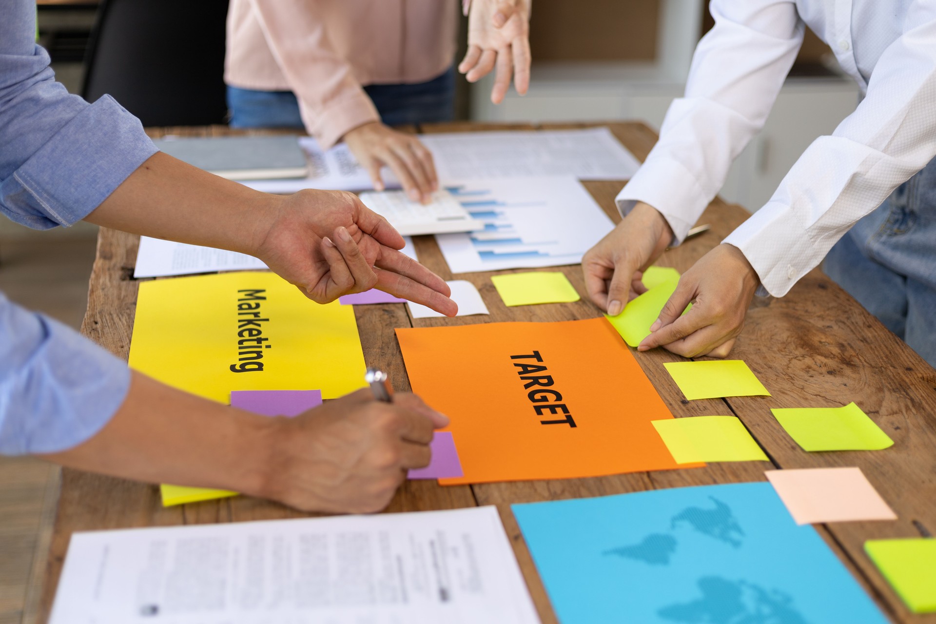 Meeting of colleagues is discussing marketing strategy analysis and planning to achieve business goals.